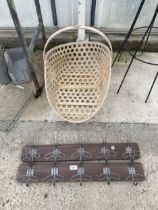 TWO WALL MOUNTED HAT AND COAT RACKS AND A WICKER TRUG BASKET