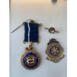 TWO HALLMARKED BIRMINGHAM SILVER AND ENAMEL MEDALS AND A SILVER BADGE