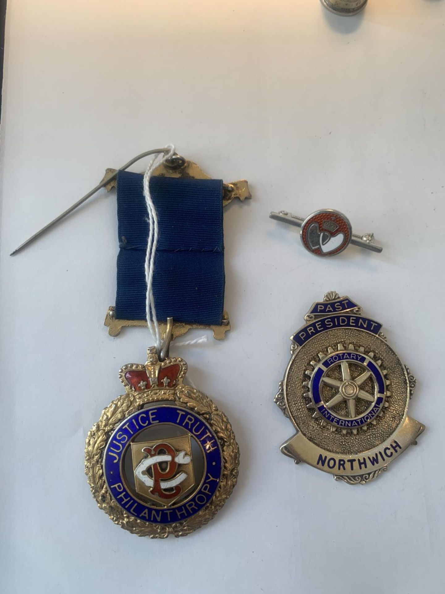 TWO HALLMARKED BIRMINGHAM SILVER AND ENAMEL MEDALS AND A SILVER BADGE