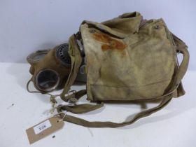 A WORLD WAR II MILITARY ISSUE GAS MASK AND BAG