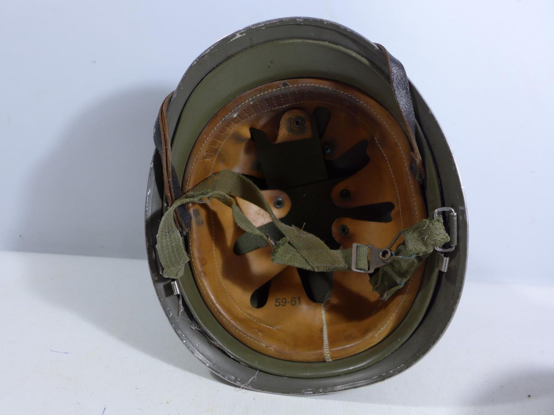 A GREEN PAINTED METAL MILITARY HELMET AND LINING - Image 4 of 6