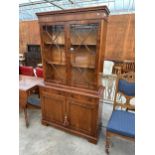 A REGENCY STYLE ASTRAL GLAZED TWO DOOR BOOKCASE ON A BASE 41.5" WIDE