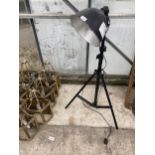 A RETRO FLOOR LAMP WITH TRIPOD STAND