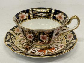 A ROYAL CROWN DERBY IMARI PATTERN CUP WITH BAT WING HANDLE AND SAUCER