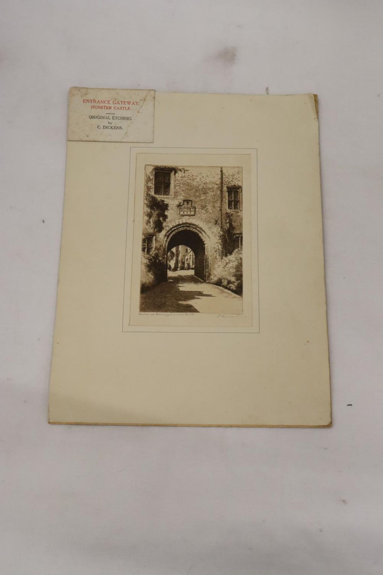 AN ORIGINAL ETCHING OF THE ENTRANCE GATEWAY TO DUNSTER CASTLE, BY C. DICKENS, SIGNED