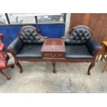 A BRASS INLAID INDIAN HARDWOOD AND BUTTONED LEATHER SCROLL END CONVERSATION DOUBLE SEAT WITH