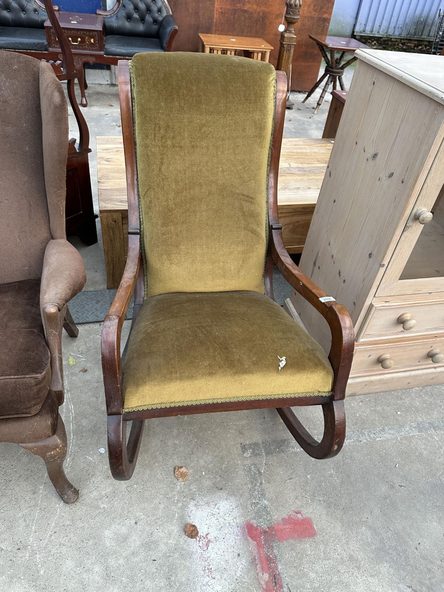 A VICTORIAN MAHOGANY ROCKING CHAIR