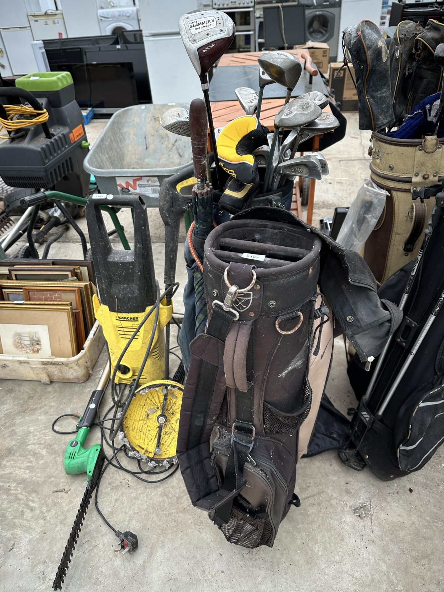 TWO GOLF BAGS AND AN ASSORTMENT OF LEFT HANDED GOLF CLUBS