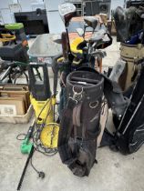 TWO GOLF BAGS AND AN ASSORTMENT OF LEFT HANDED GOLF CLUBS