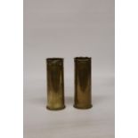 A PAIR OF WORLD WAR I TRENCH ART SHELLS, EACH WITH FLORAL DECORATION, HEIGHT 23CM