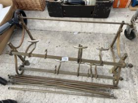 A VINTAGE BRASS TRAIN LUGGAGE RACK AND COAT HOOKS