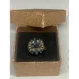 A VINTAGE DRESS RING WITH BLUE STONES AND PEARLS IN A PRESENTATION BOX