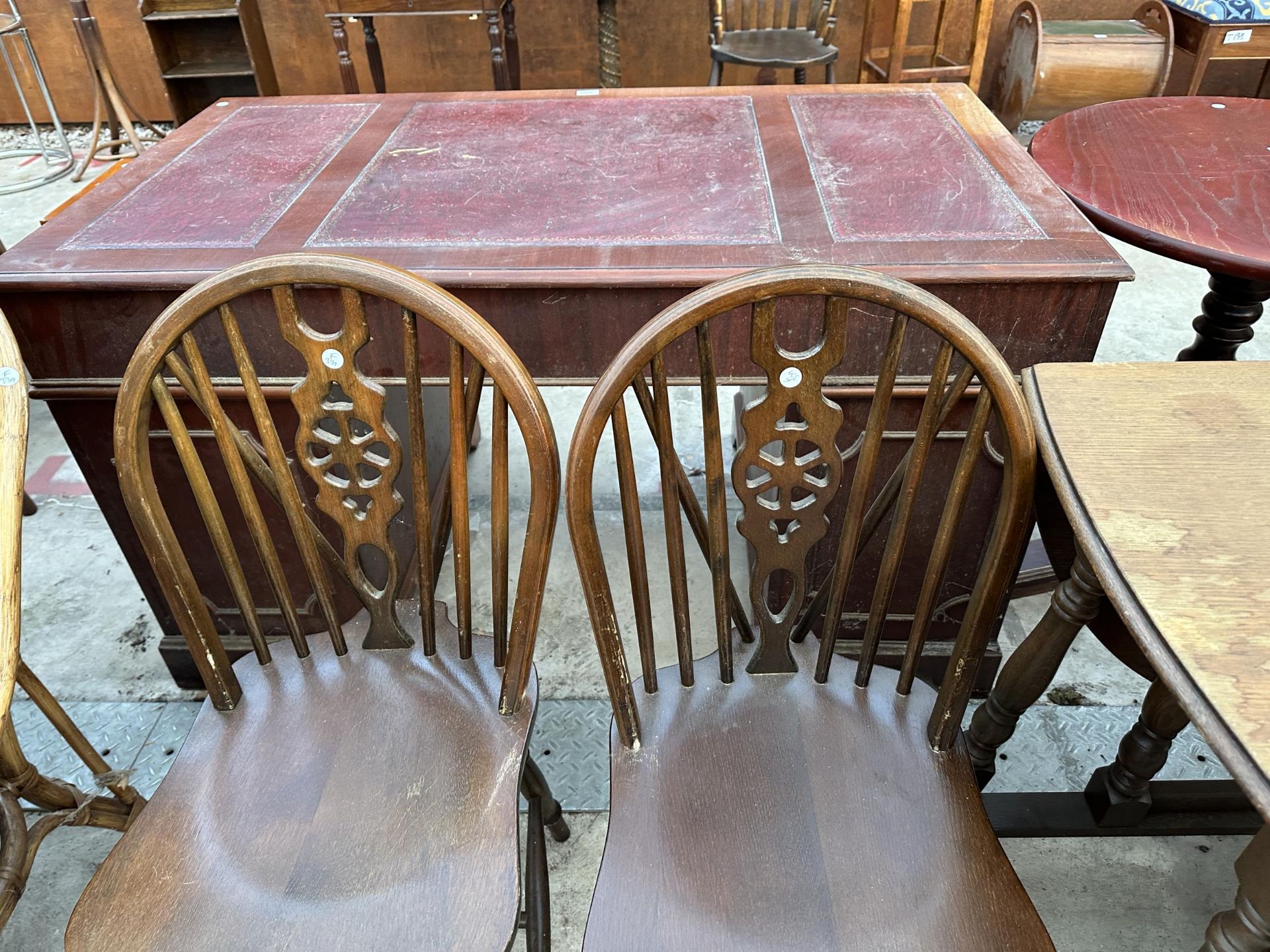 AN OVAL OAK GATELEG DINING TABLE 59" X38" OPENED AND FOUR WHEEL BACK WINDSOR STYLE CHAIRS - Image 6 of 7