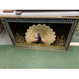 A LARGE GILT FRAMED EMBROIDERED COLLAGE OF A PEACOCK