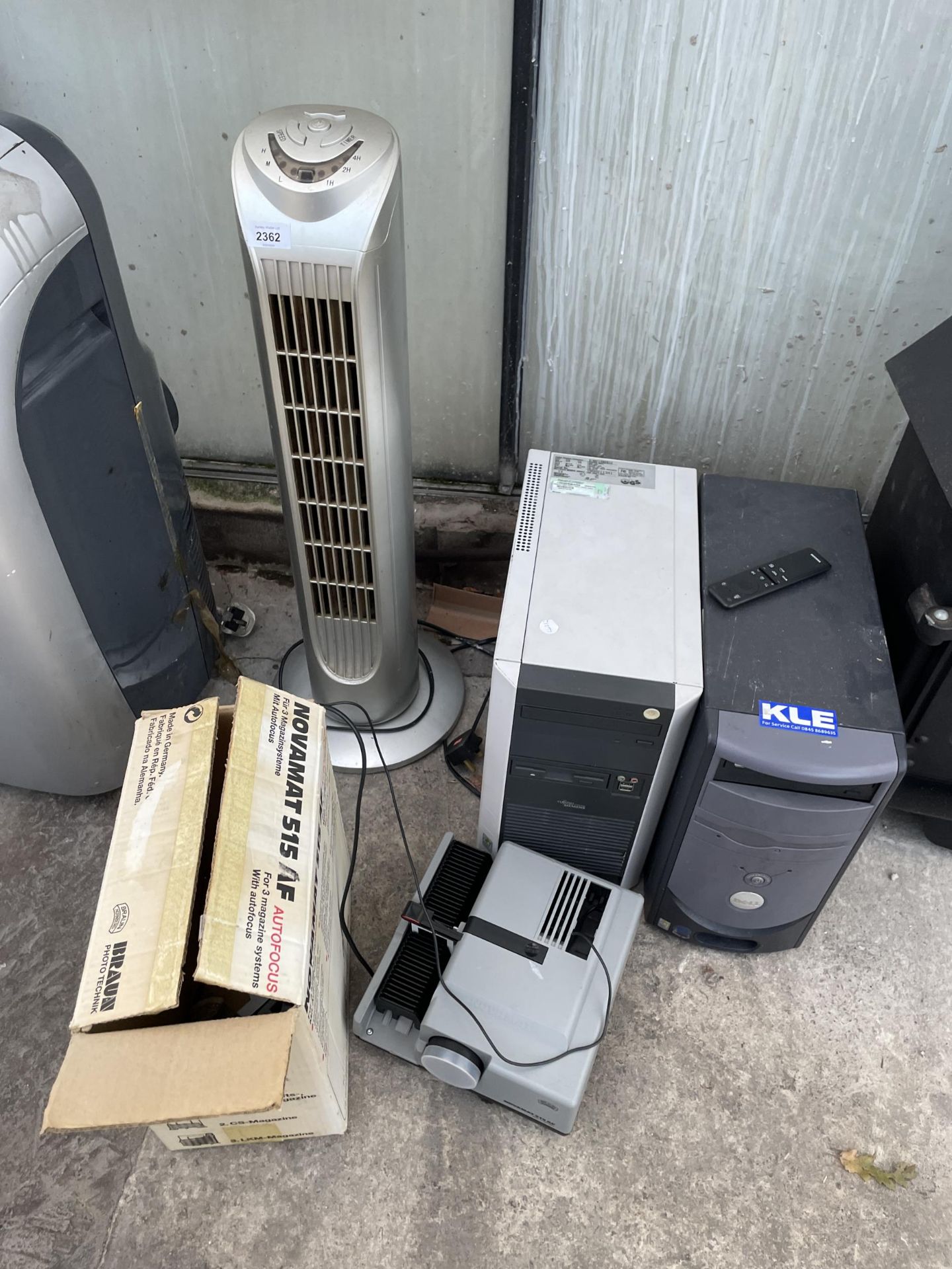 AN ASSORTMENT OF ITEMS TO INCLUDE A SLIDE PROJECTOR, A FAN AND COMPUTER TOWERS ETC