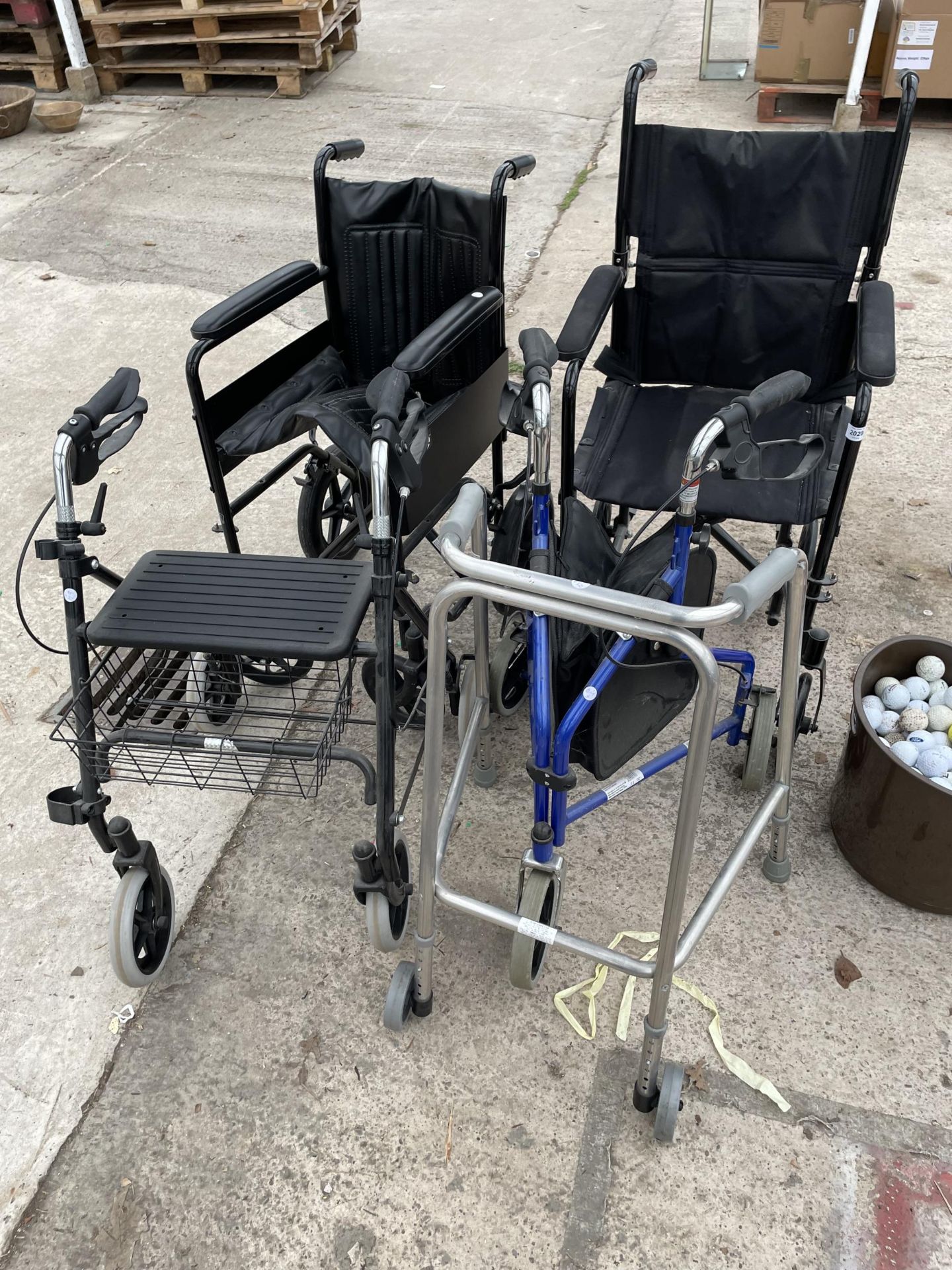 AN ASSORTMENT OF MOBILITY AIDS TO INCLUDE TWO WHEEL CHAIRS AND WALKING FRAMES ETC