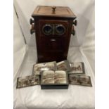 A VINTAGE REVOLVING STEREOSCOPE VIEWER WITH A BOXED SET OF CARD