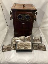A VINTAGE REVOLVING STEREOSCOPE VIEWER WITH A BOXED SET OF CARD