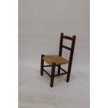 A VINTAGE CHILD'S CHAIR WITH RUSH SEAT