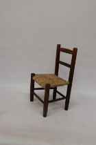 A VINTAGE CHILD'S CHAIR WITH RUSH SEAT