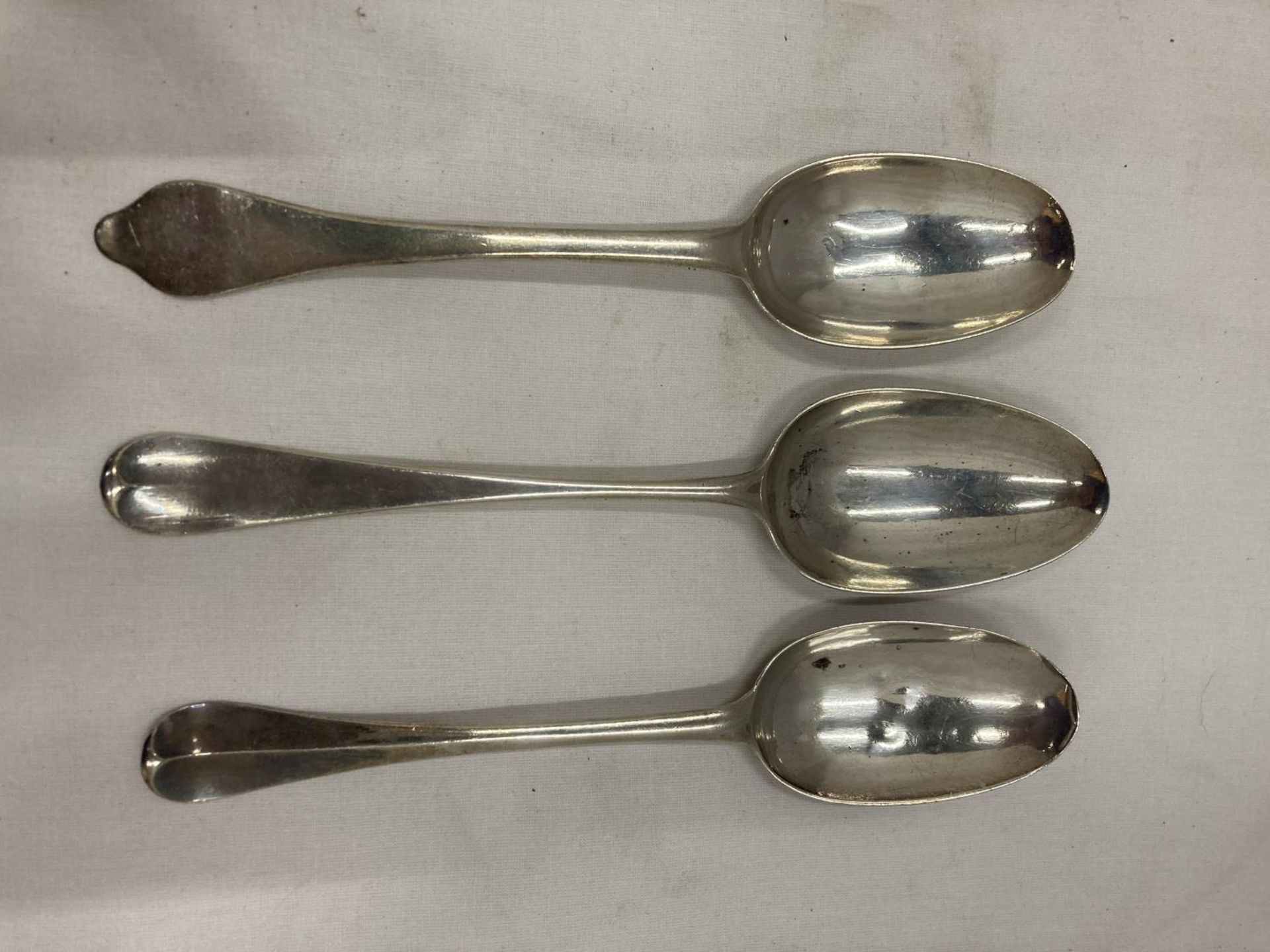 THREE MARKED SILVER SERVING SPOONS GROSS WEIGHT 393.3 GRAMS
