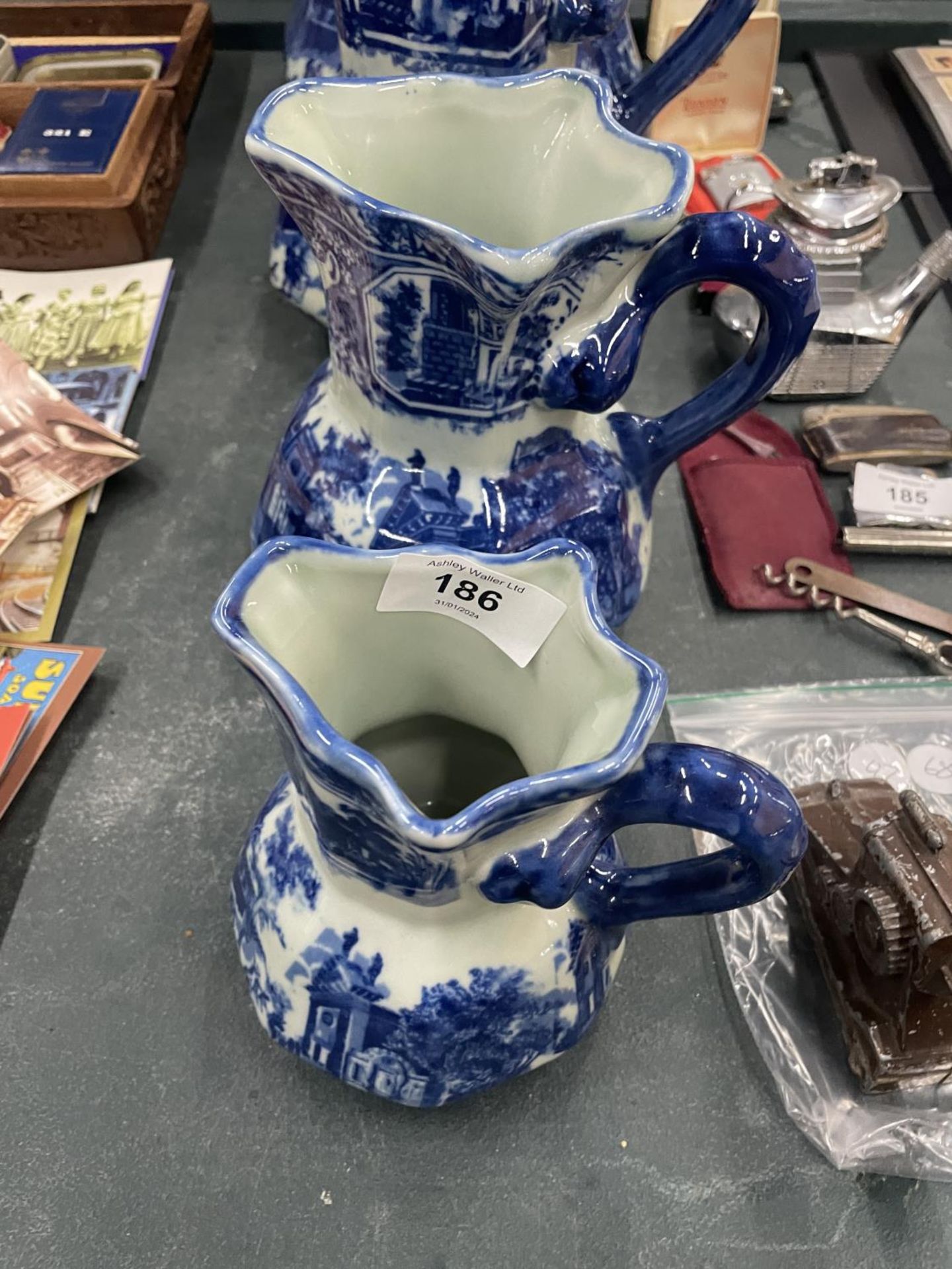 FOUR MATCHING, GRADUATING BLUE AND WHITE IRONSTONE JUGS, LARGEST HEIGHT 23CM - Image 2 of 4