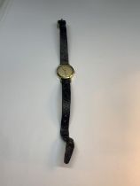 A 9 CARAT GOLD CASED ETERNA-MATIC WRIST WATCH WITH LEATHER STRAP