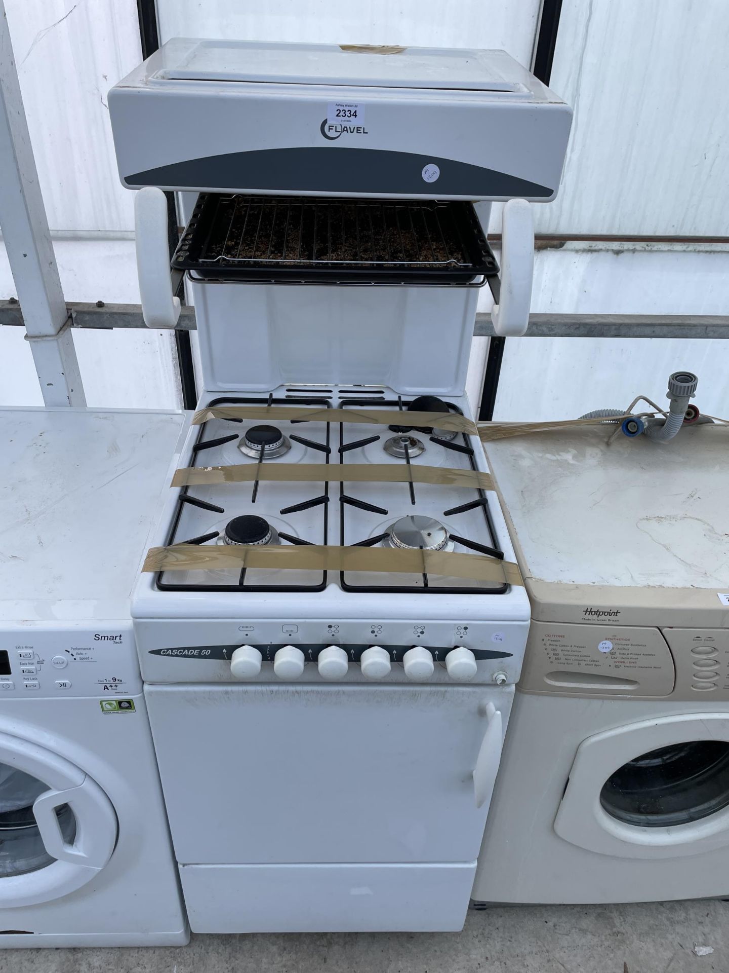 A WHITE FREESTANDING FLAVEL CASCADE 50 GAS OVEN AND HOB