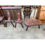 A SPANISH STYLE HARDWOOD COFFEE TABLE AND A PAIR OF STOOLS