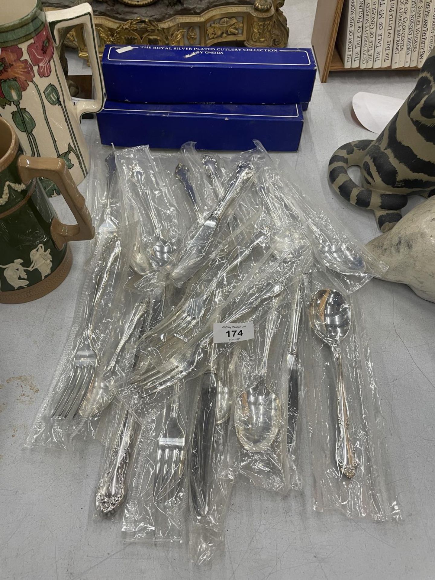 A QUANTITY OF SILVER PLATED CUTLERY BY ONEIDA