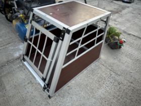 A SMALL WOODEN AND METAL CAR DOG CRATE