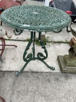 A VINTAGE GREEN METAL BISTRO TABLE