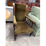 A VICTORIAN MAHOGANY FIRESIDE CHAIR WITH TURNED LEGS AND SPINDLES