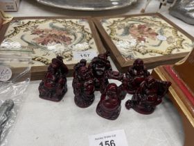 A SET OF SIX DIFFERENT RED BUDDAHS
