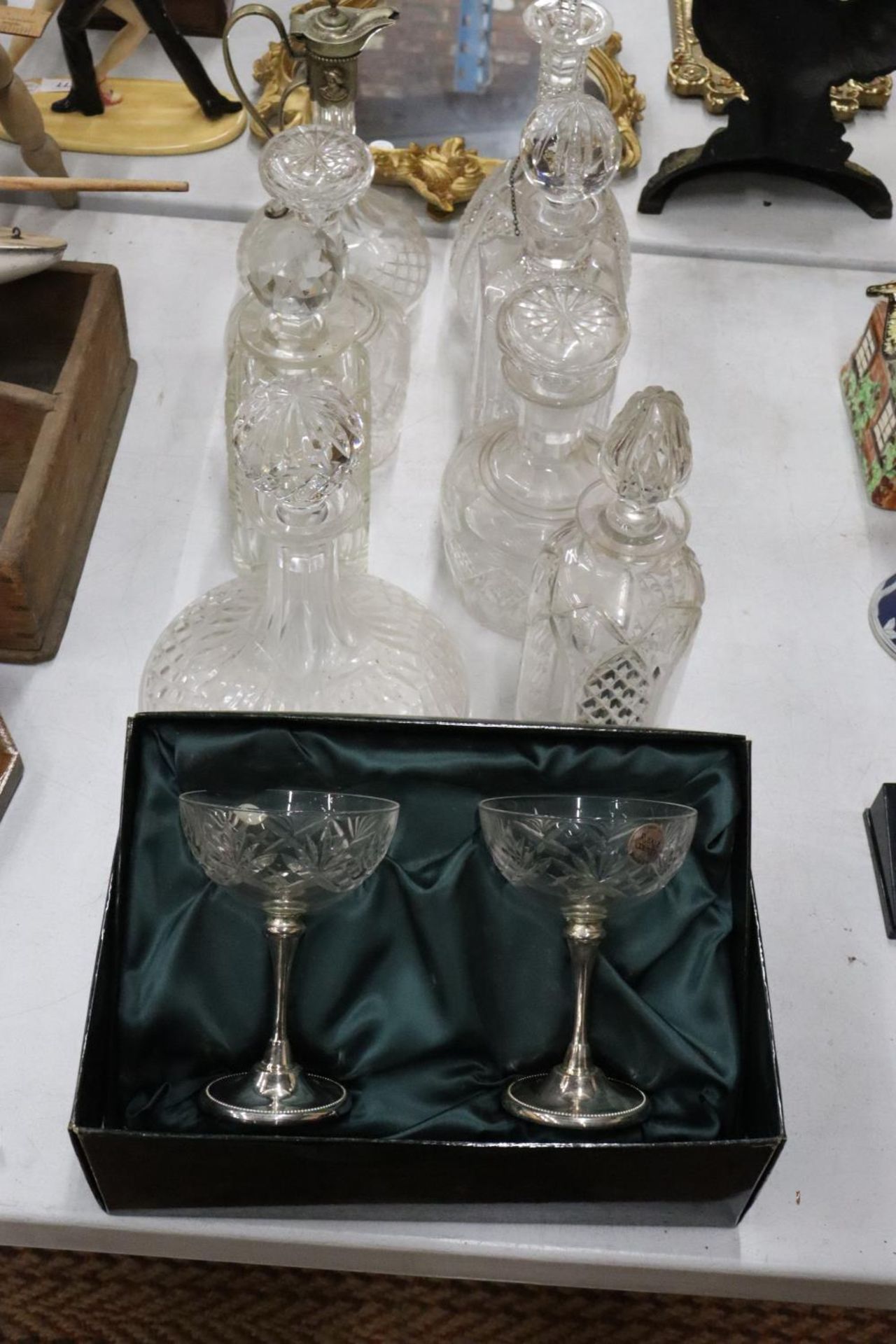 VARIOIUS GLASS WARE TO INCLUDE A CLARET JUG, SEVEN DECANTERS AND A BOXED PAUIR OF CHAMPAGNE GLASSES