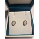 A PAIR OF 9 CARAT GOLD AND OPAL EARRINGS IN A PRESENTATION BOX