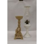 A WHITE BASED GLASS FLUTED SHADE OIL LAMP AND A CHERUB DESIGN FLOWER ARRANGIMG STAND