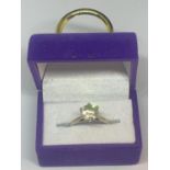 A SILVER RING WITH SOLITAIRE CLEAR STONE IN A PRESENTATION BOX