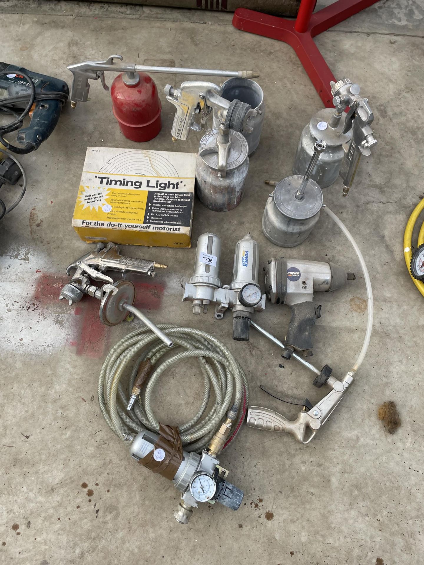 AN ASSORTMENT OF AIR COMPRESSER ATTATCHMENTS TO INCLUDE PAINT SPRAYERS AND AN IMPACT WRENCH ETC