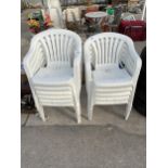 ELEVEN WHITE PLASTIC STACKING GARDEN CHAIRS