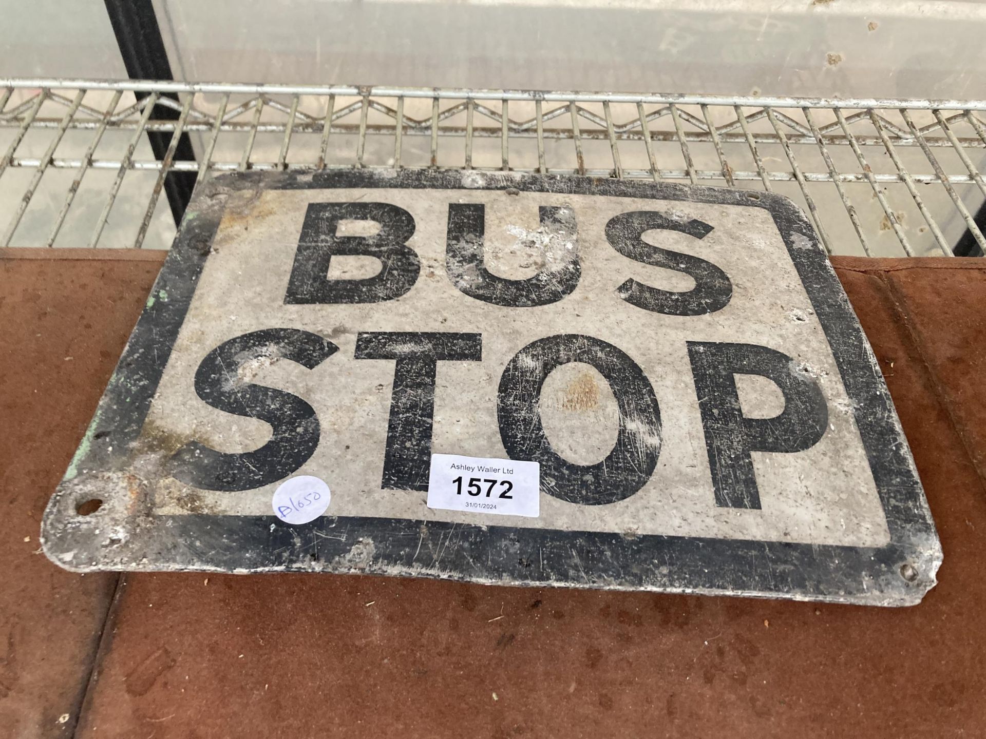 AN ALLOY BUS STOP SIGN