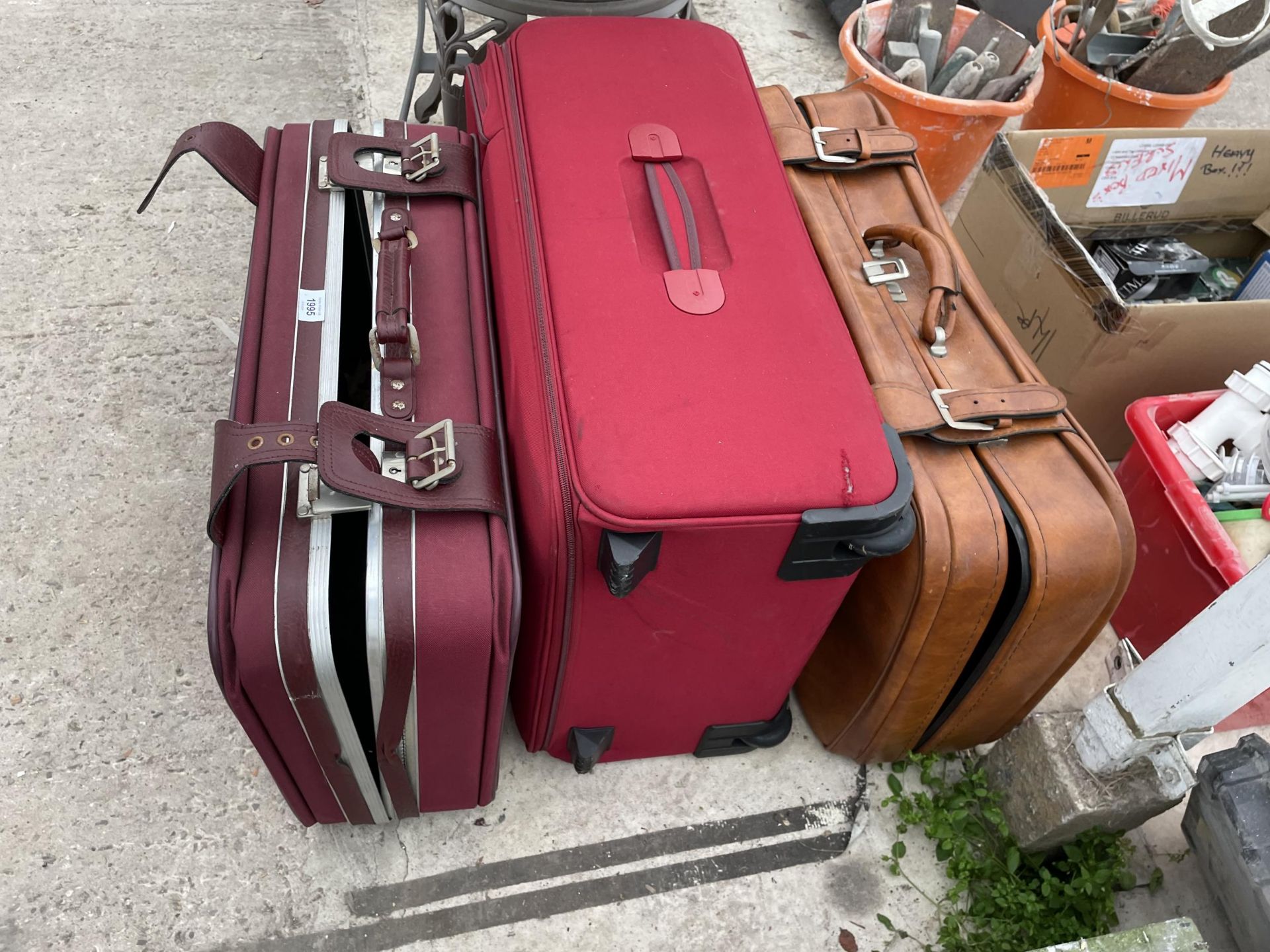 THREE VARIOUS SUITCASES