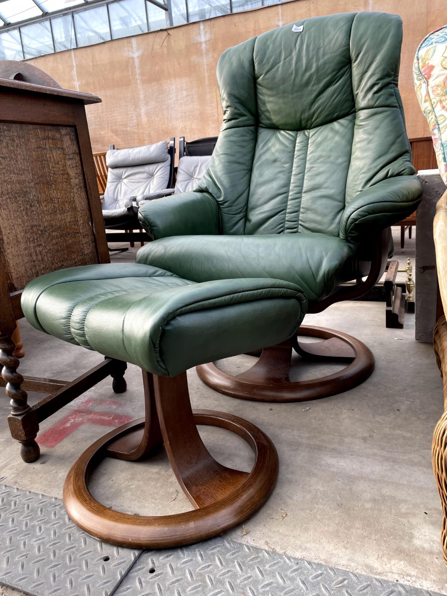 A GREEN LEATHER SWIVEL RECLINER AND STOOL - Image 2 of 3