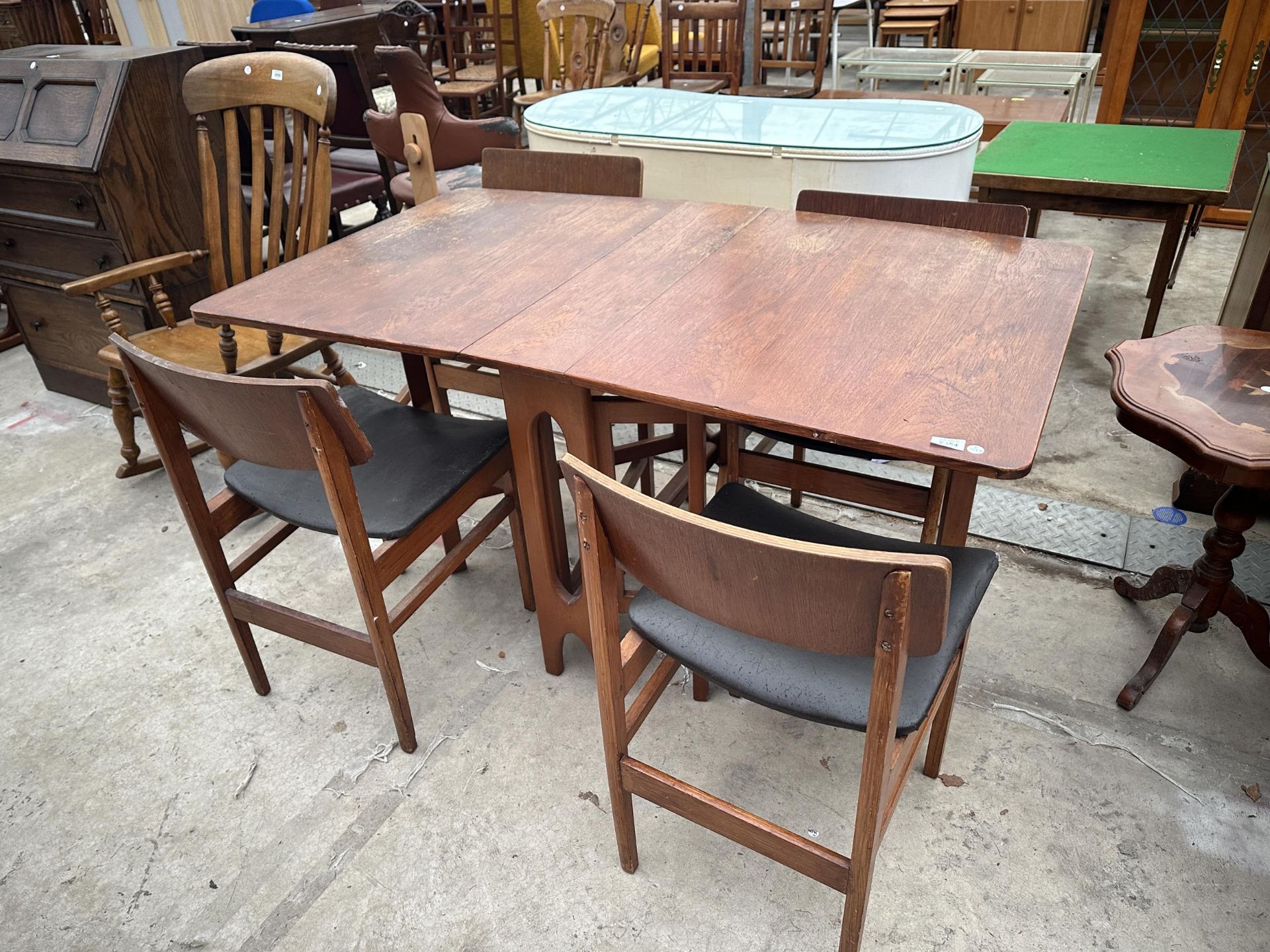 A RETRO TEAK GATE LEG DINING TABLE, 57" X 32.5" OPEN (7.5" CLOSED), AND FOUR CHAIRS
