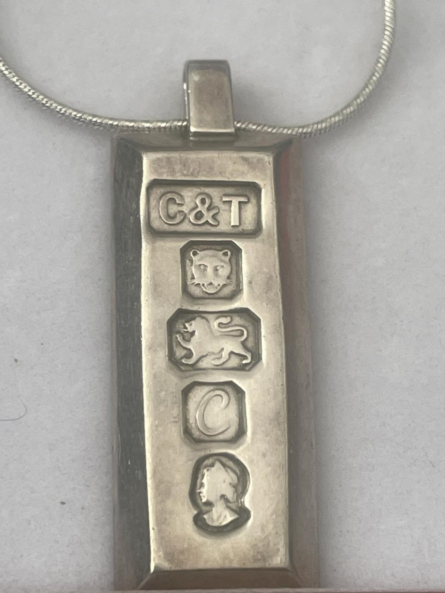 A SILVER INGOT IN A PRESENTATION BOX - Image 2 of 2