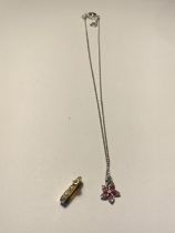 A SWAROVSKI CRYSTAL NECKLACE AND A FURTHER PENDANT