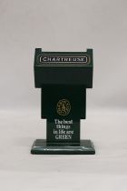 A CHARTREUSE ELEVATING AND DECLINING CIGARETTE DISPENSER