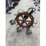 A VINTAGE CEILING MOUNTED LIGHT FITTING WITH SHIPS WHEEL DESIGN