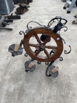 A VINTAGE CEILING MOUNTED LIGHT FITTING WITH SHIPS WHEEL DESIGN