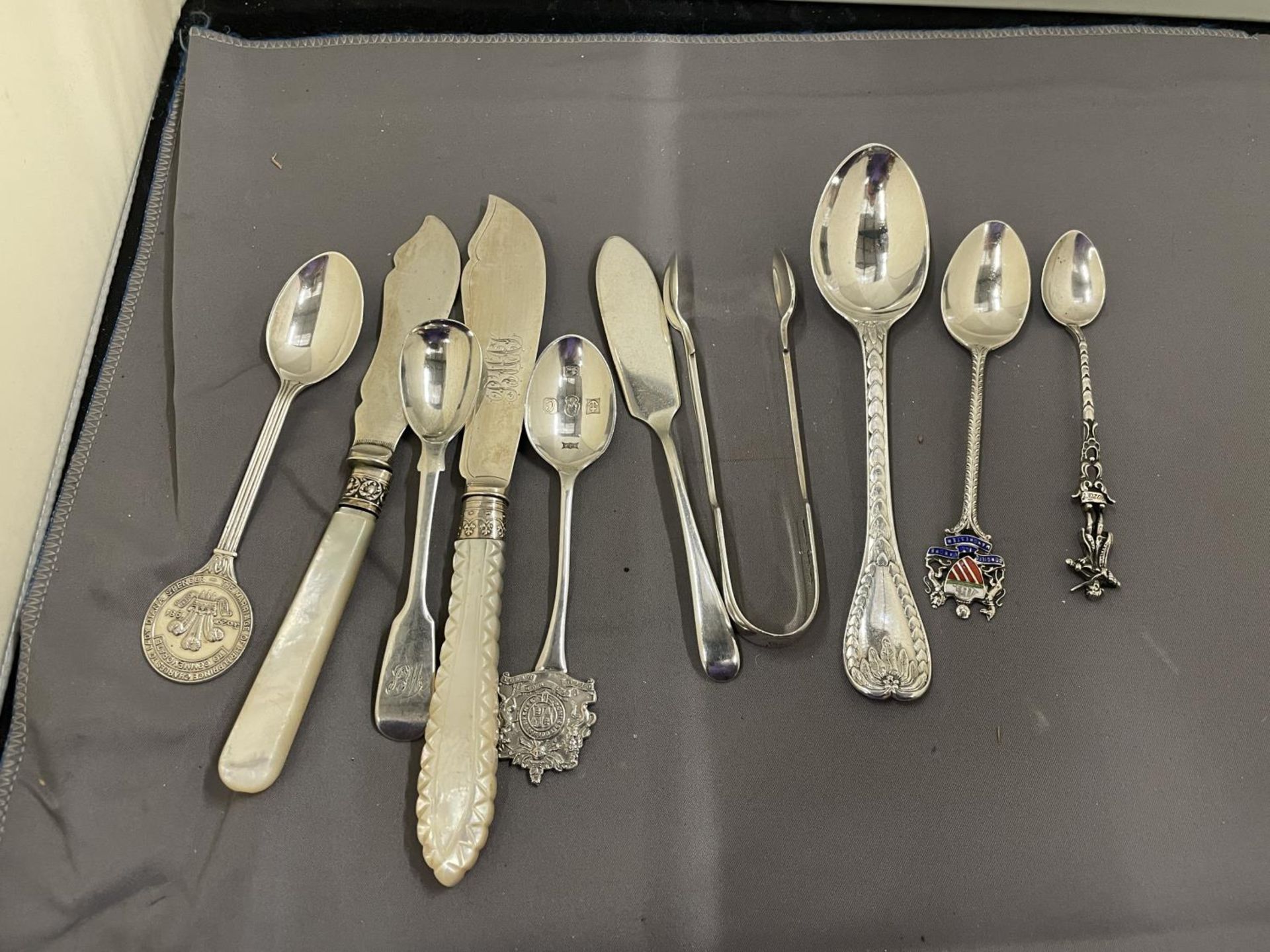 TEN PIECES OF VARIOUS MARKED SILVER ITEMS TO INCLUDE NIPS, FORKS, SPOONS AND KNIVES